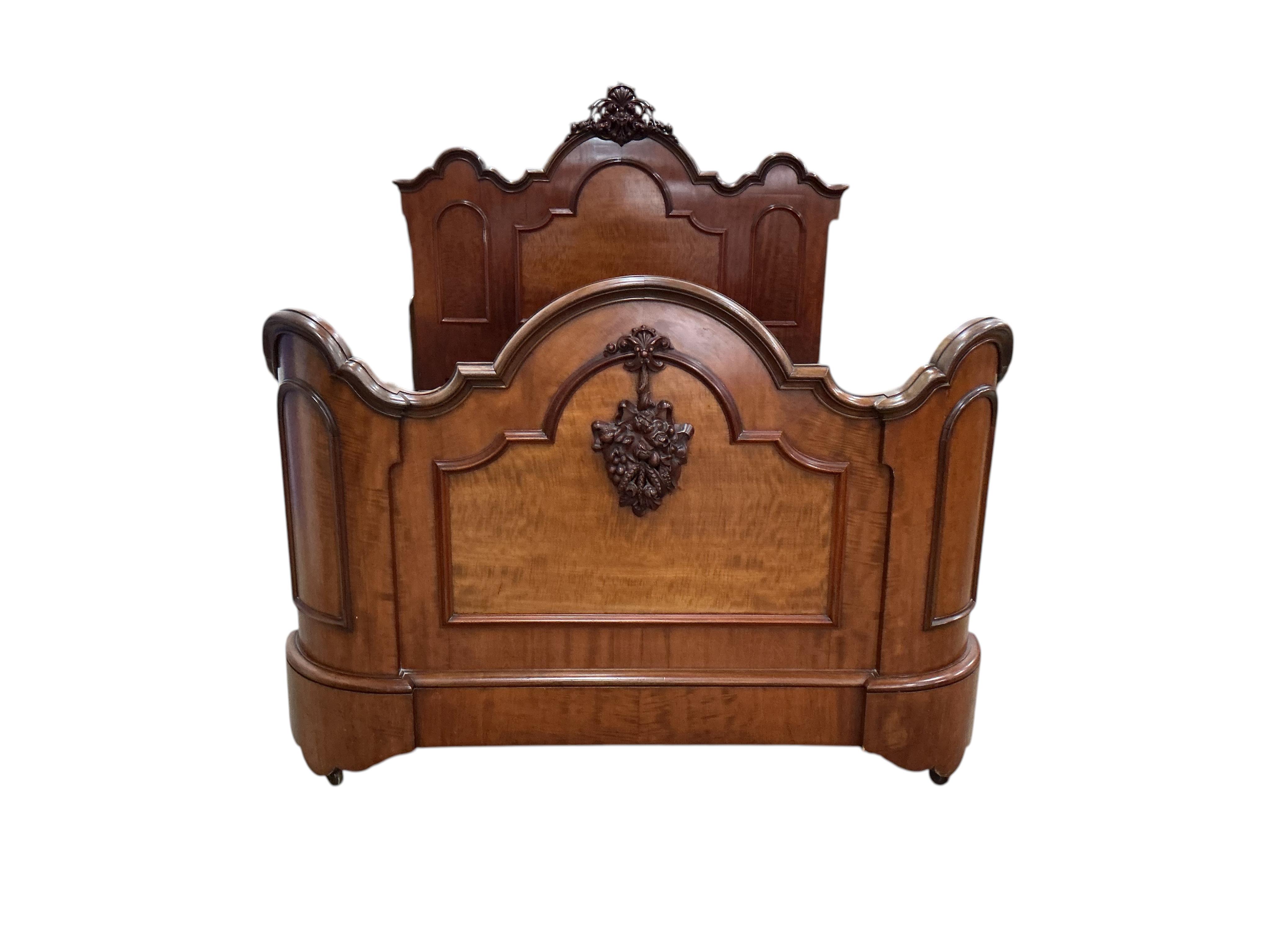 A Victorian carved mahogany double bed frame, width 154cm, height 156cm